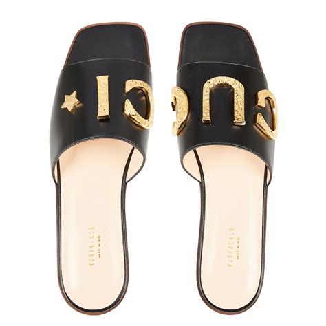 Women's slide sandal with Gucci script .